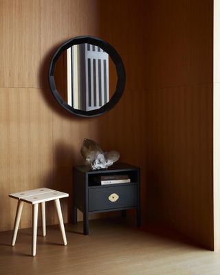 Studio Seitz design showroom in Williamsburg: wall mirror and stool.