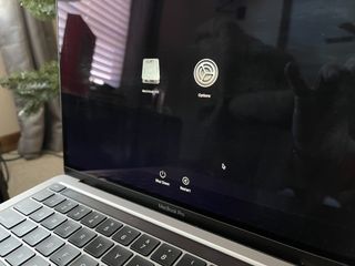 To restore your Mac to factory settings, shutdown your Mac, then hold the power button until you see the startup options