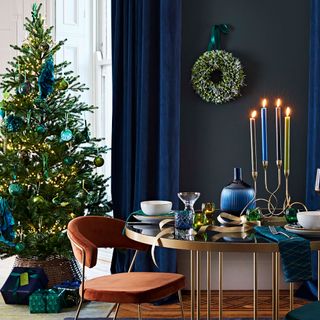 christmas tree with table and candle