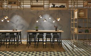 Dining tables with stools in a room with botanical-style wallpaper and geometric floor tiles