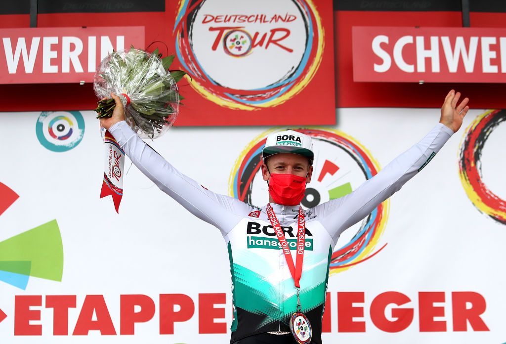 SCHWERIN GERMANY AUGUST 26 Pascal Ackermann of Germany and Team Bora Hansgrohe celebrates at podium as stage winner during the 35th Deutschland Tour 2021 Stage 1 a 191km stage from Stralsund to Schwerin DeineTour on August 26 2021 in Schwerin Germany Photo by Christian KasparBartkeGetty Images