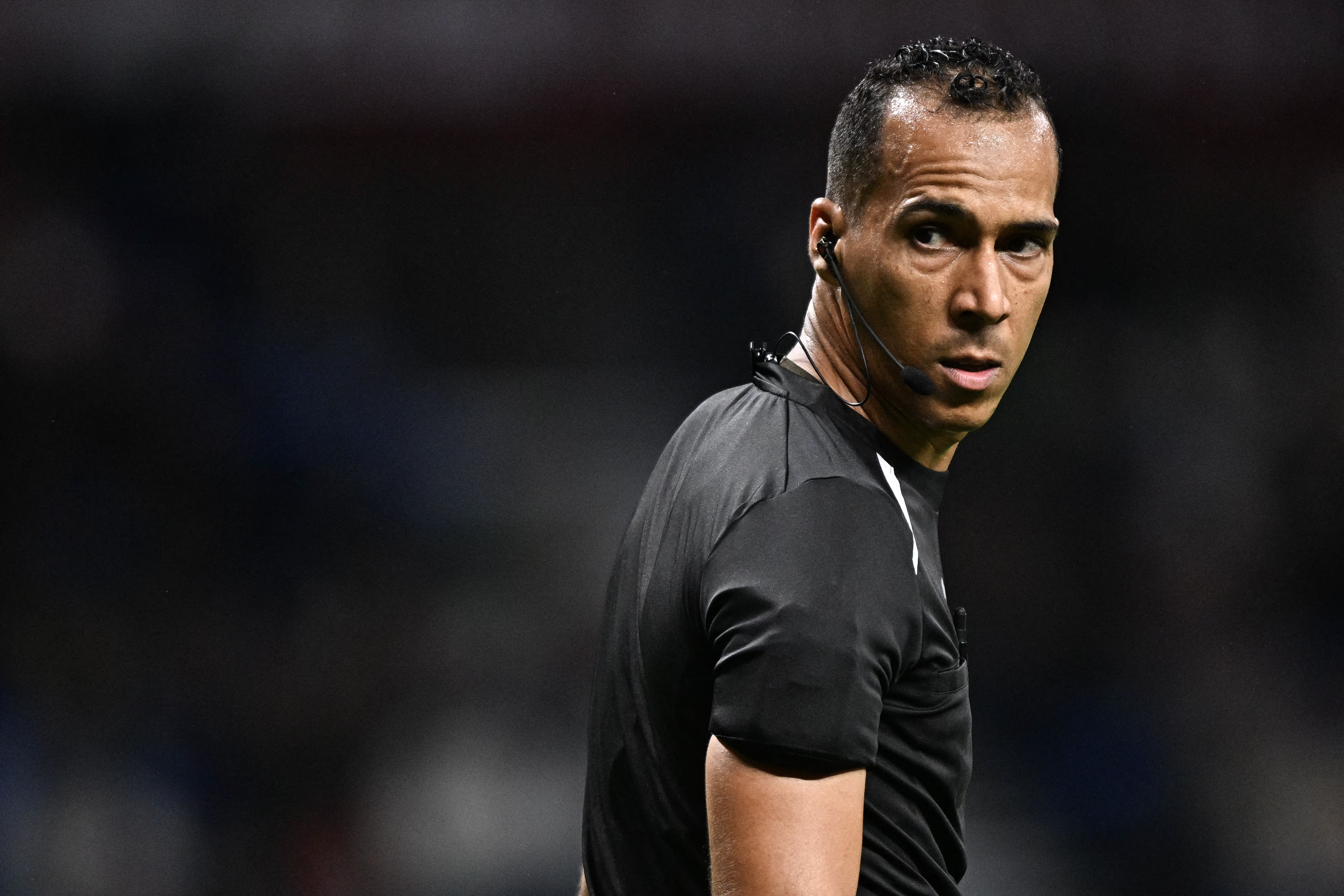 Mauritania's referee Dahane Beida looks on during the Africa Cup of Nations (CAN) round of 16 football match between Senegal and Sudan at Grand Stadium in Tangiers on January 3, 2026. (Photo by Gabriel BOUYS / AFP)