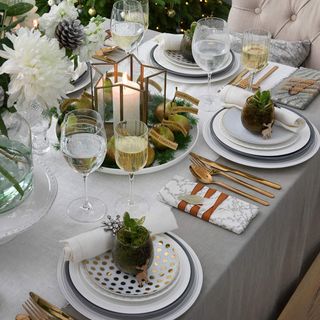 Christmas table with pear centrepiece and succulents on the place settings