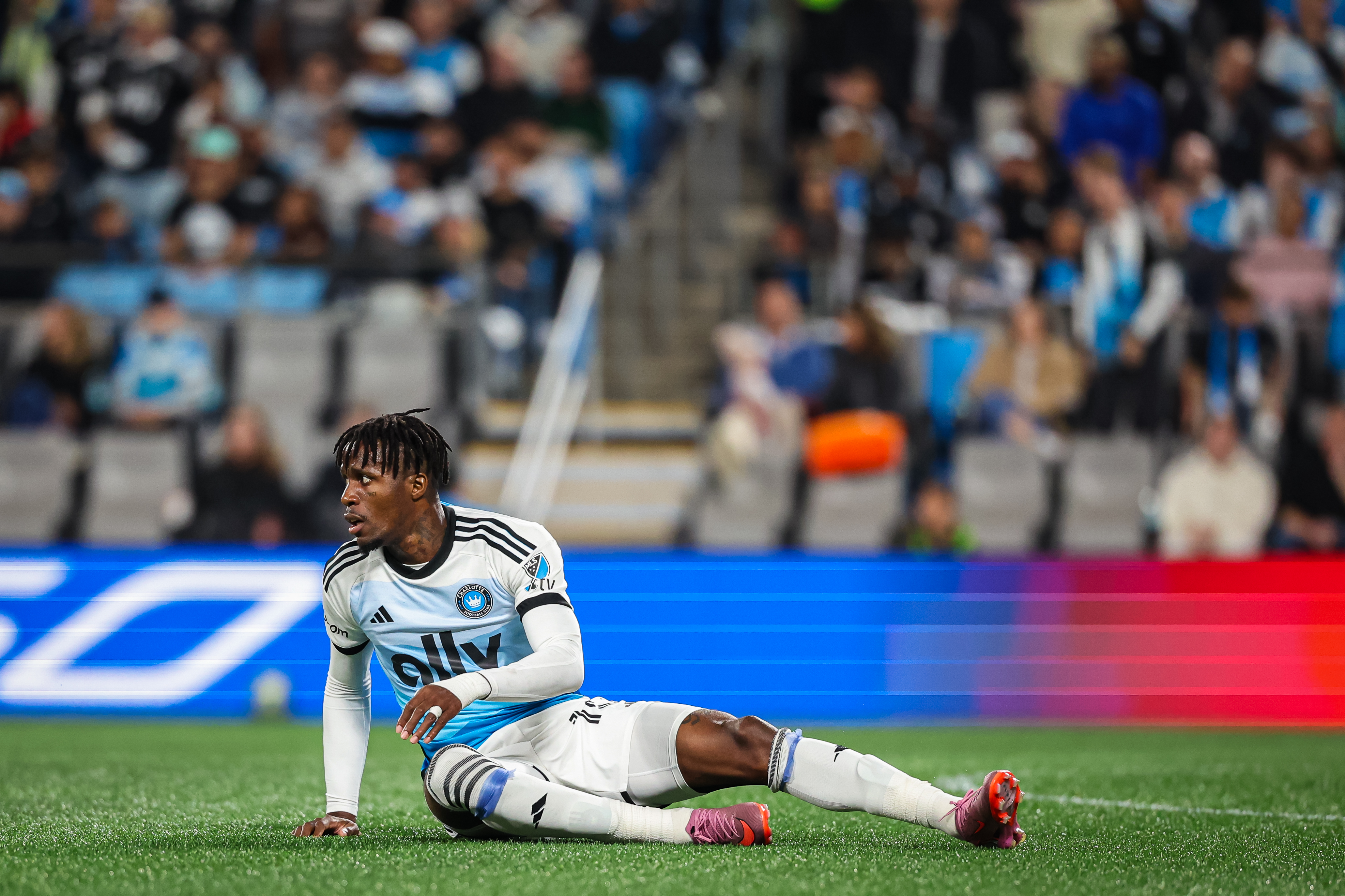 CHARLOTTE, NORTH CAROLINA - NOVEMBER 07: Wilfried Zaha #10 of Charlotte FC reacts after taking a hit during the first half of a soccer match against New York City at Bank of America Stadium on November 07, 2025 in Charlotte, North Carolina. (Photo by David Jensen/Getty Images)