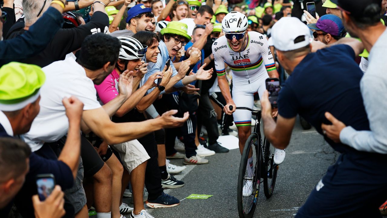Tadej Pogacar surrounded by fans