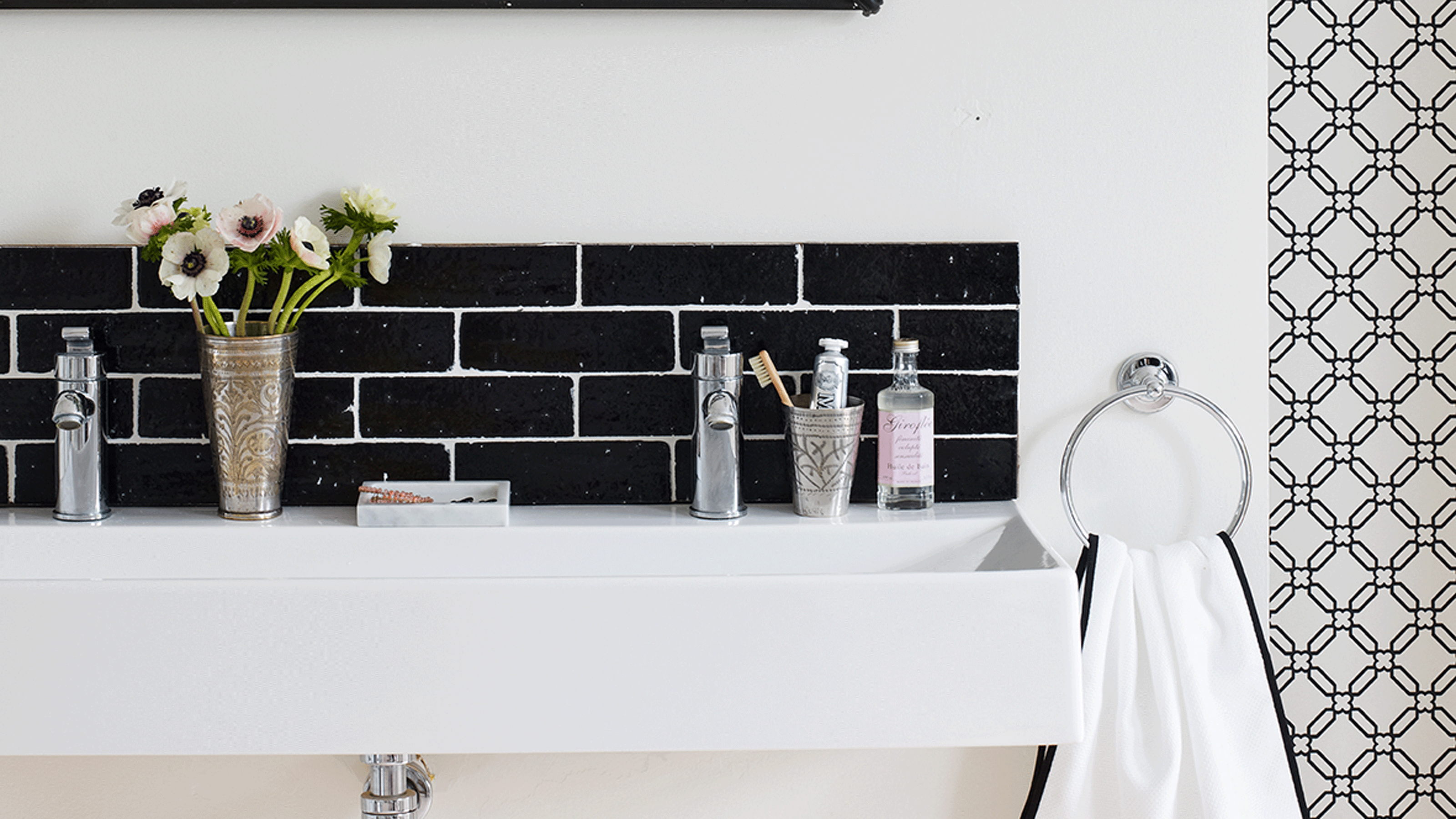 Utility room, butler belfast sink, storage shelves, assorted storage jars storing wooden dolly pegs and cleaning products