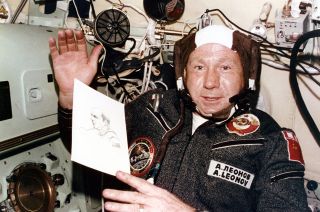 Cosmonaut Alexei Leonov aboard the Apollo-Soyuz Test Project with a sketch he made of one of his American crewmates.