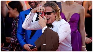 Chris Pine takes a picture on the "Don't Worry Darling" red carpet at the 79th Venice International Film Festival on September 05, 2022 in Venice, Italy.