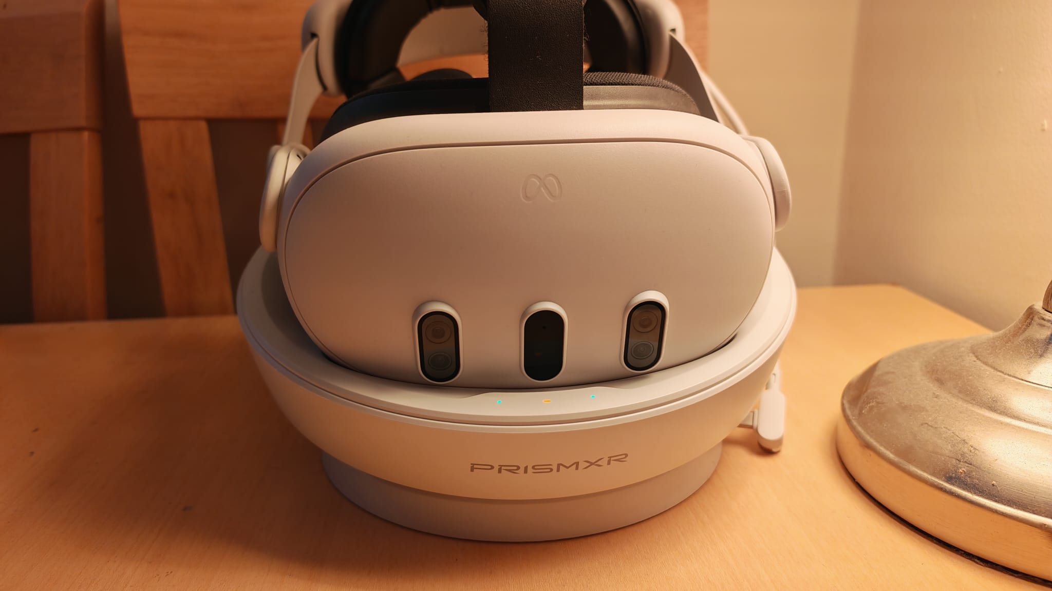 The Meta Quest 3 charging on the PRismXR charging dock
