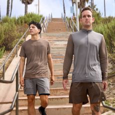 Two men walking down steps in RVCA apparel