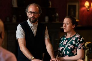 Reiss Colwell and Sonia Fowler standing next to each other in the Queen Vic pub