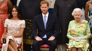 Meghan, Duchess of Sussex, Prince Harry, Duke of Sussex and Queen Elizabeth II at the Queen's Young Leaders Awards Ceremony