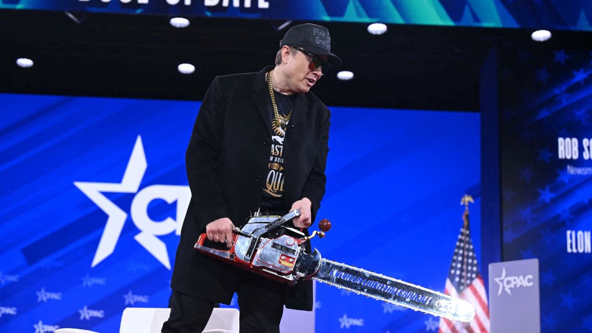 Elon Musk holding chainsaw at CPAC 