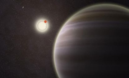 An artist's rendition of the newly discovered planet named PH1, seen in the foreground. The planet is 3,200 light-years away from Earth.