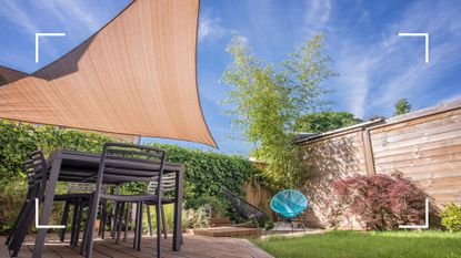 picture of shade sail in a uk garden over a table and chairs set