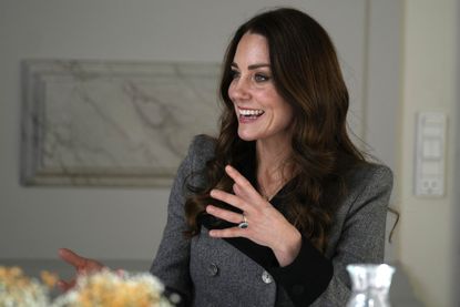 Catherine, Duchess of Cambridge speaks during a meeting with personnel during a visit to the Danner Crisis Center on February 23, 2022
