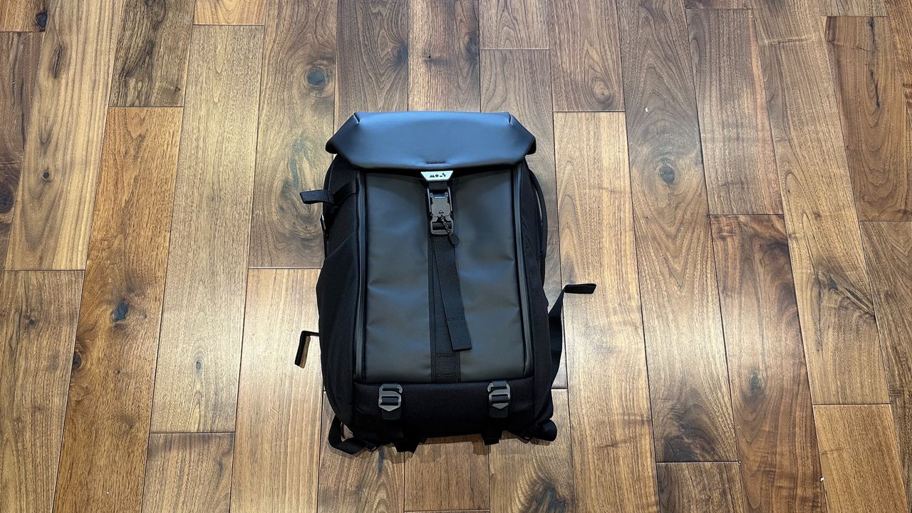 Mous Extreme Commuter backpack on a wooden floor in a living room