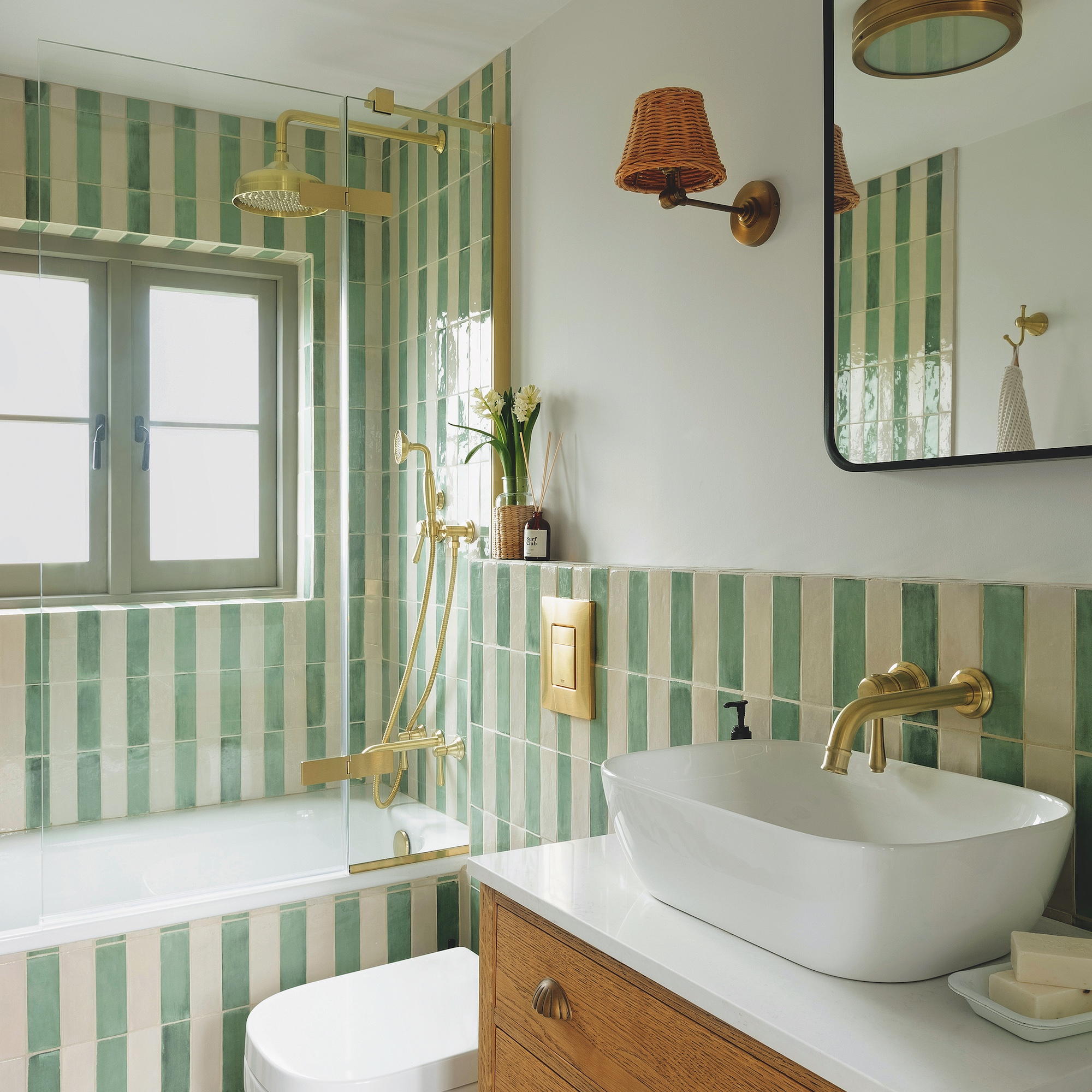 bathroom with green and white vertical stripe tiling