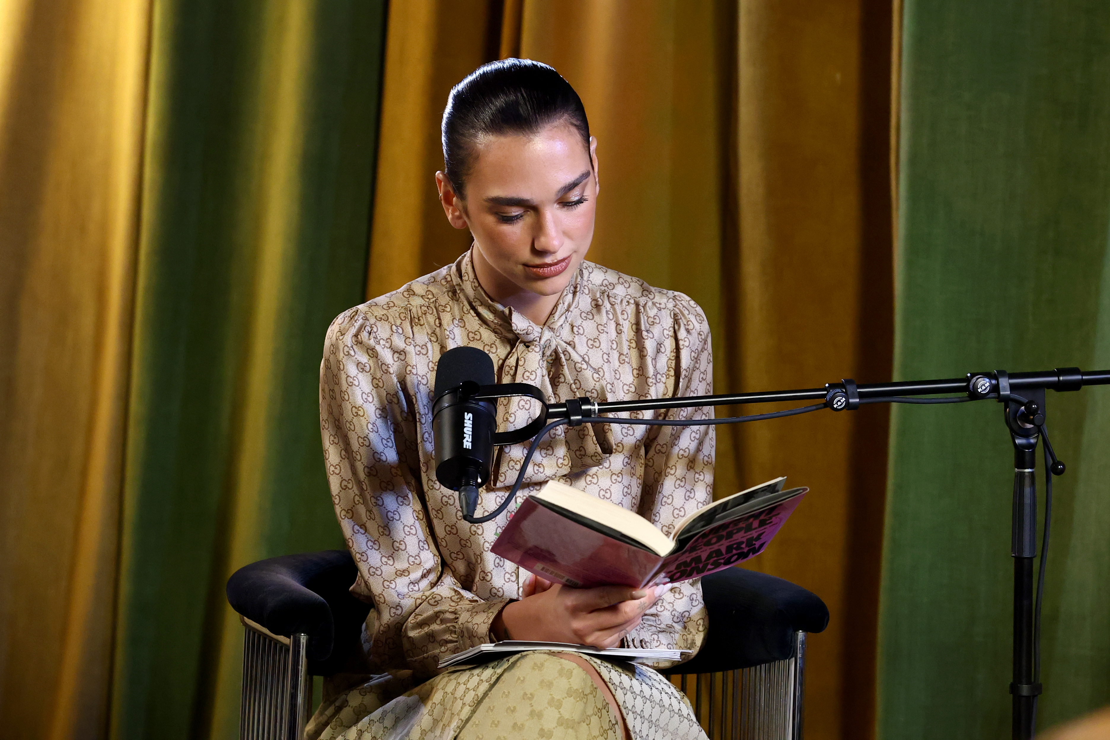 Dua Lipa hosted a book club event last December in head-to-toe Gucci