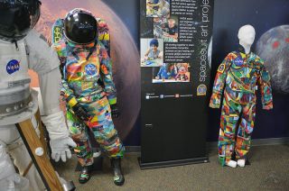 The Spacesuit Art Project's first two spacesuits, "Hope" (at left) and "Courage." The latter was worn in space in 2016.