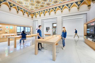 A team of conservators worked thousands of hours to restore the geometrically patterned, hand-painted ceiling above the Genius Bar.