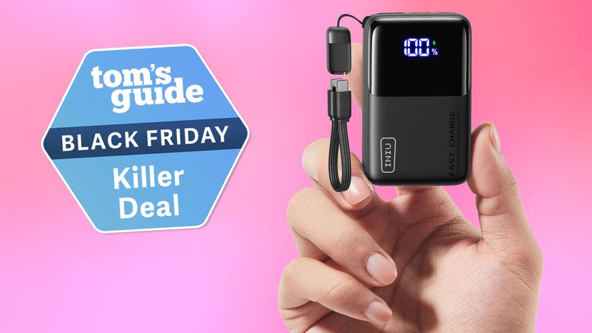 The Iniu Pocket Rocket portable charger in hand, against a pink background, with a Tom&#039;s Guide deal badge on the left of the image.