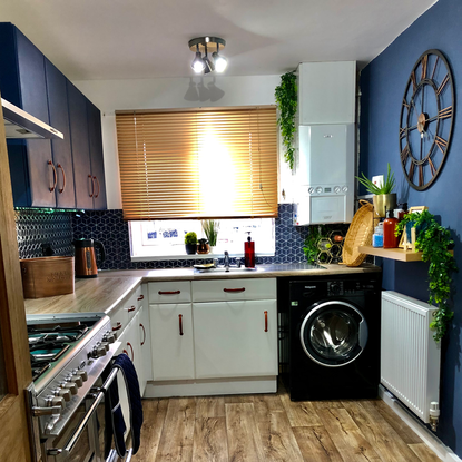 kitchen with blue cabinets and worktop