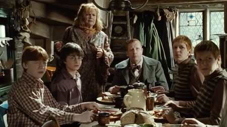 Harry and the Weasley Family having breakfast at The Burrow in Harry Potter and the Chamber of Secrets.