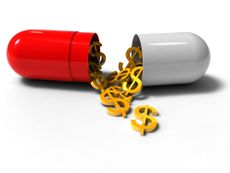 An oversized medicine capsule that is open with gold dollar signs spilling out. 