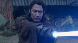 Lee Jung-jae as Master Sol holding a lightsaber in The Acolyte