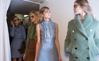 Female models dressed in the Guccii A/W 2014 backstage of the fashion show