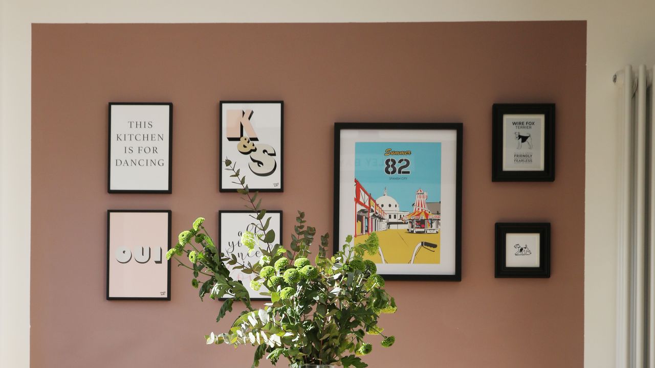 pink painted picture wall with gallery wall of art prints