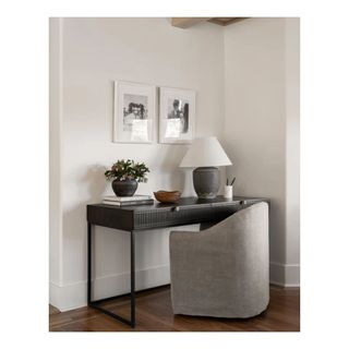 home office desk in black with grey chair and table lamp