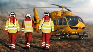 Three paramedics facing away from the camera walking to a helicopter for Rescue: Extreme Medics series 2