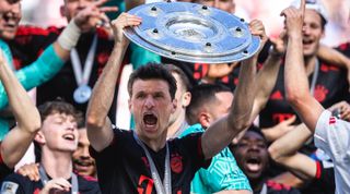 COLOGNE, GERMANY - MAY 27: Thomas Mueller of Muenchen celebrates the winning of the championship at the ceremony after the Bundesliga match between 1.FC Koeln and FC Bayern Muenchen at RheinEnergieStadion on May 27, 2023 in Cologne, Germany. (Photo by Mika Volkmann/Getty Images)