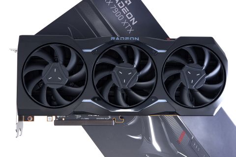 AMD Radeon RX 7900 XTX photographed with box on a white background.