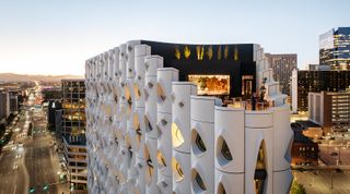 Popular hotel with an organically inspired facade and irregular openings