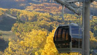 The gondola on beaver creek mountain in Colorado set against the fall colors