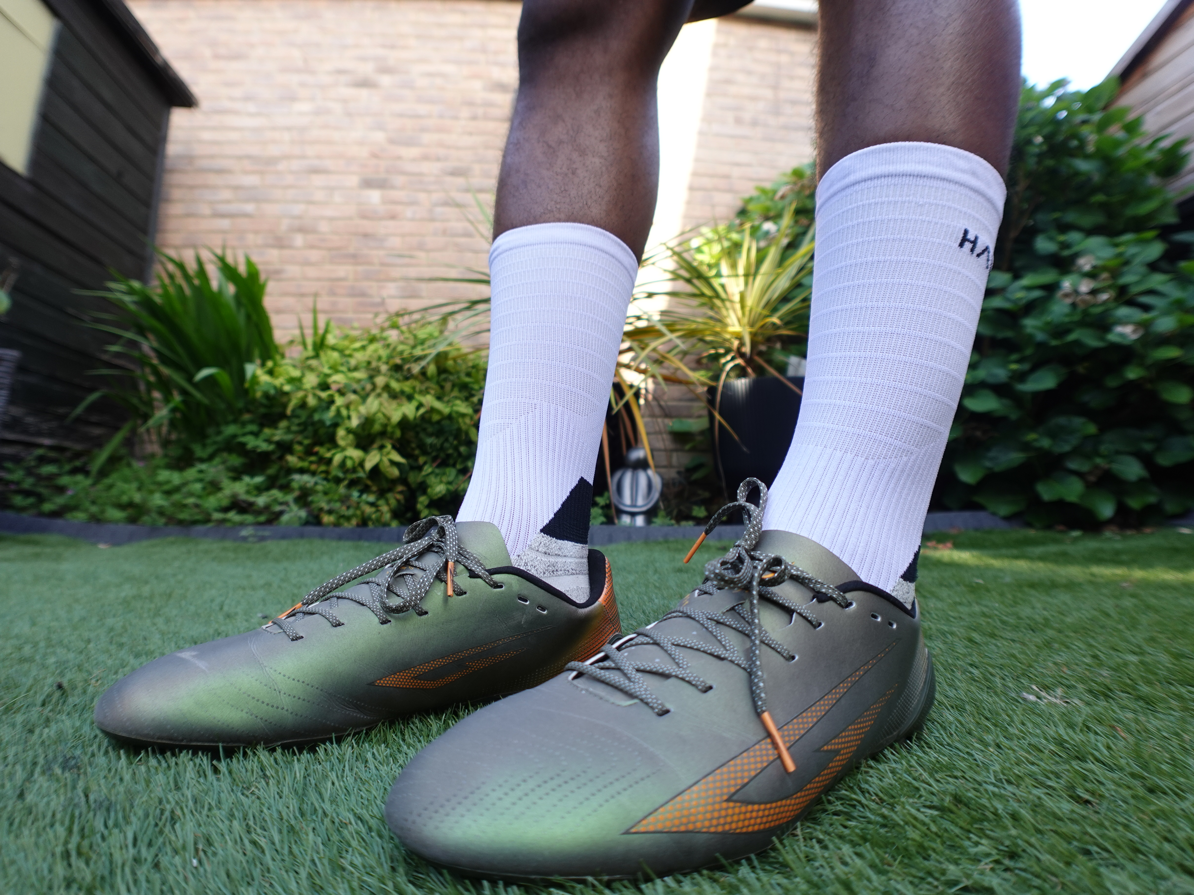 Sokito Scudetta Biotouch FG football boots photographed on astro turf