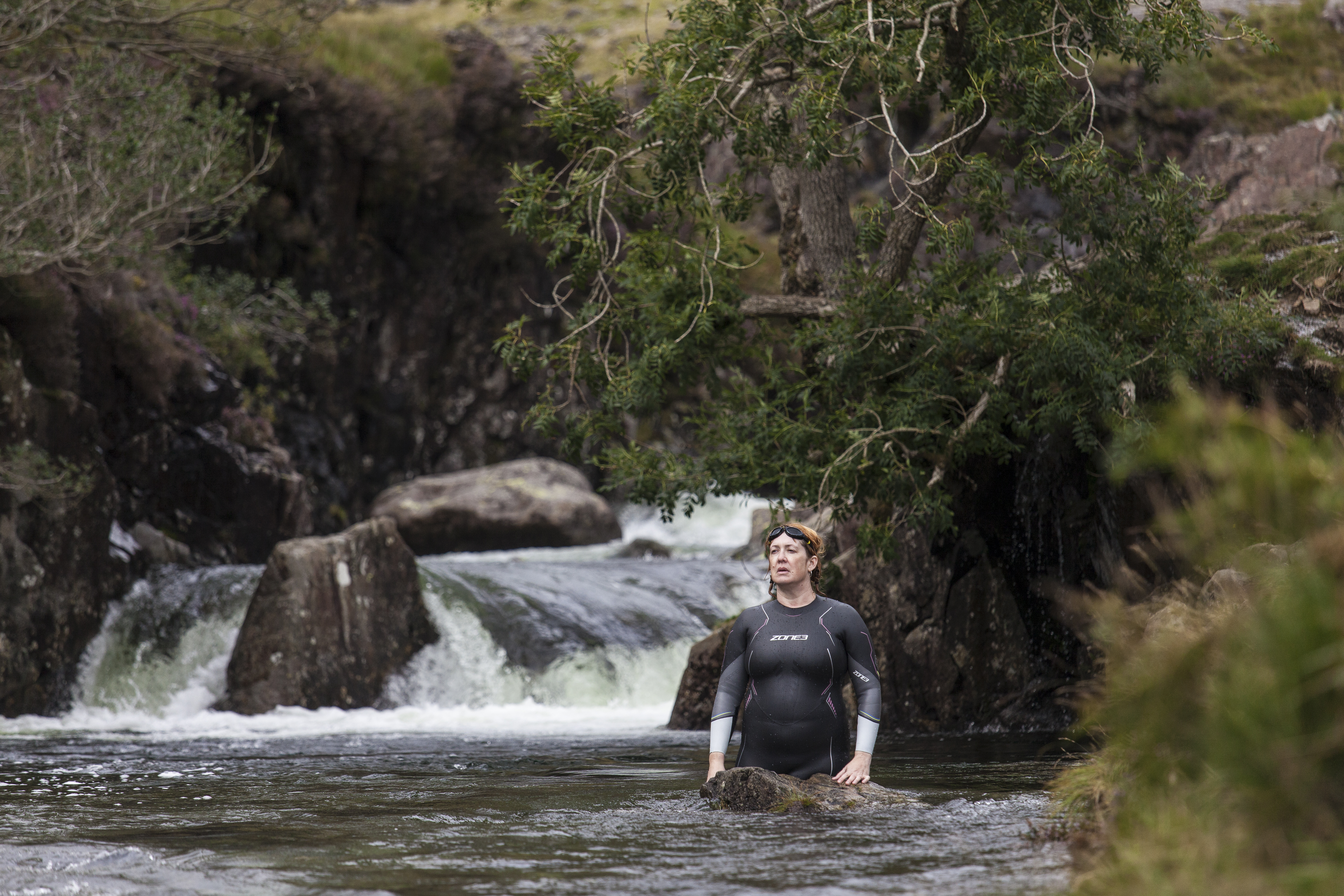 woman wearing a wetsuit in the River Esk