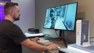 A person playing Pragmata on the Asus ROG NUC 16 mini gaming PC