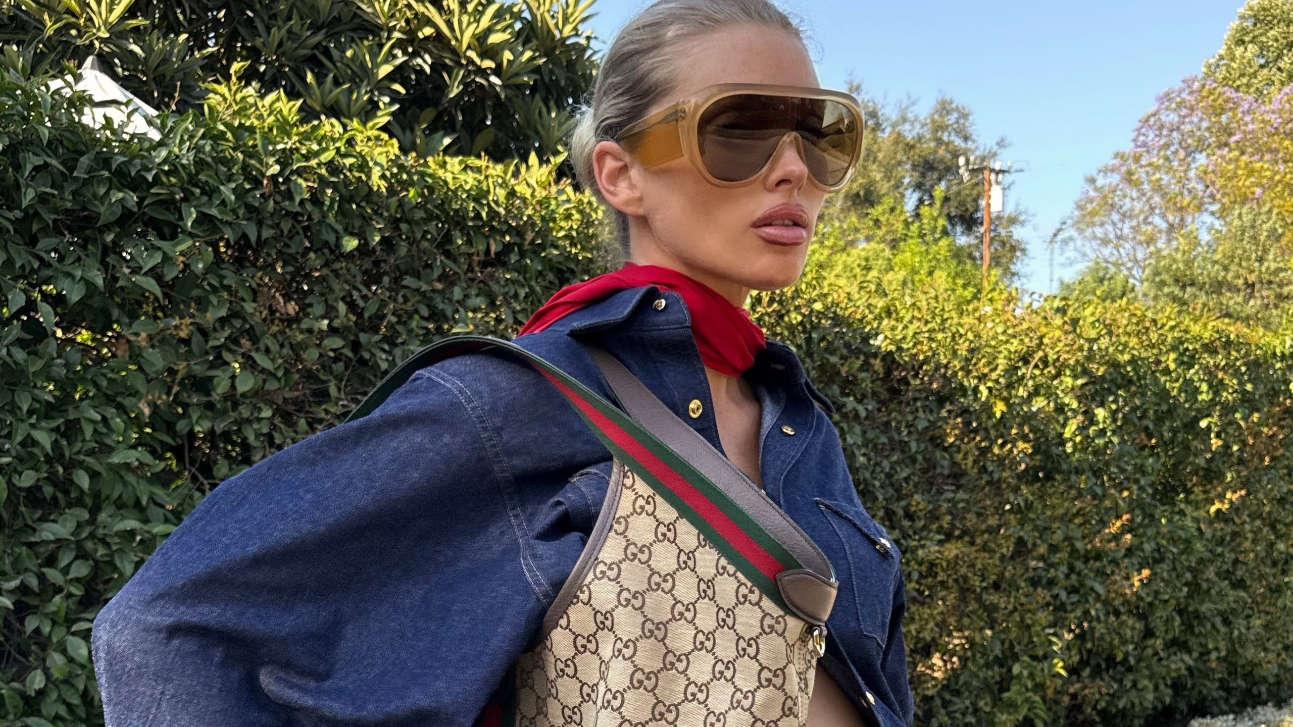 Woman wears Gucci Giglio bag, one of the best Gucci bags on the market.