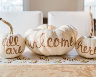pumpkins painted with welcome message