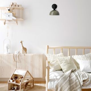 White room with lamp and wooden furniture