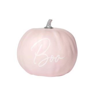 A pink pumpkin decoration that says 