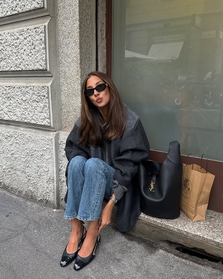 @fakerstrom wears a grey jacket, blue jeans, ballet flats and a Saint Laurent bag
