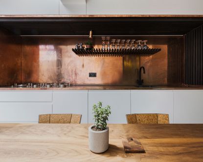 Modern kitchen with metal backsplash wall