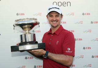 Justin Rose holds the Hong Kong Open trophy in 2015