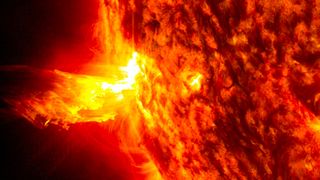 On June 20, 2013, at 11:15 p.m. EDT, the sun shot out a solar flare (left side), which was followed by an eruption of solar material shooting through the sun's atmosphere.