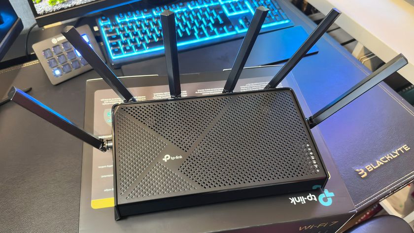 A photo showing a top-down view of a TP-Link Archer BE9700 Wi-Fi 7 router.